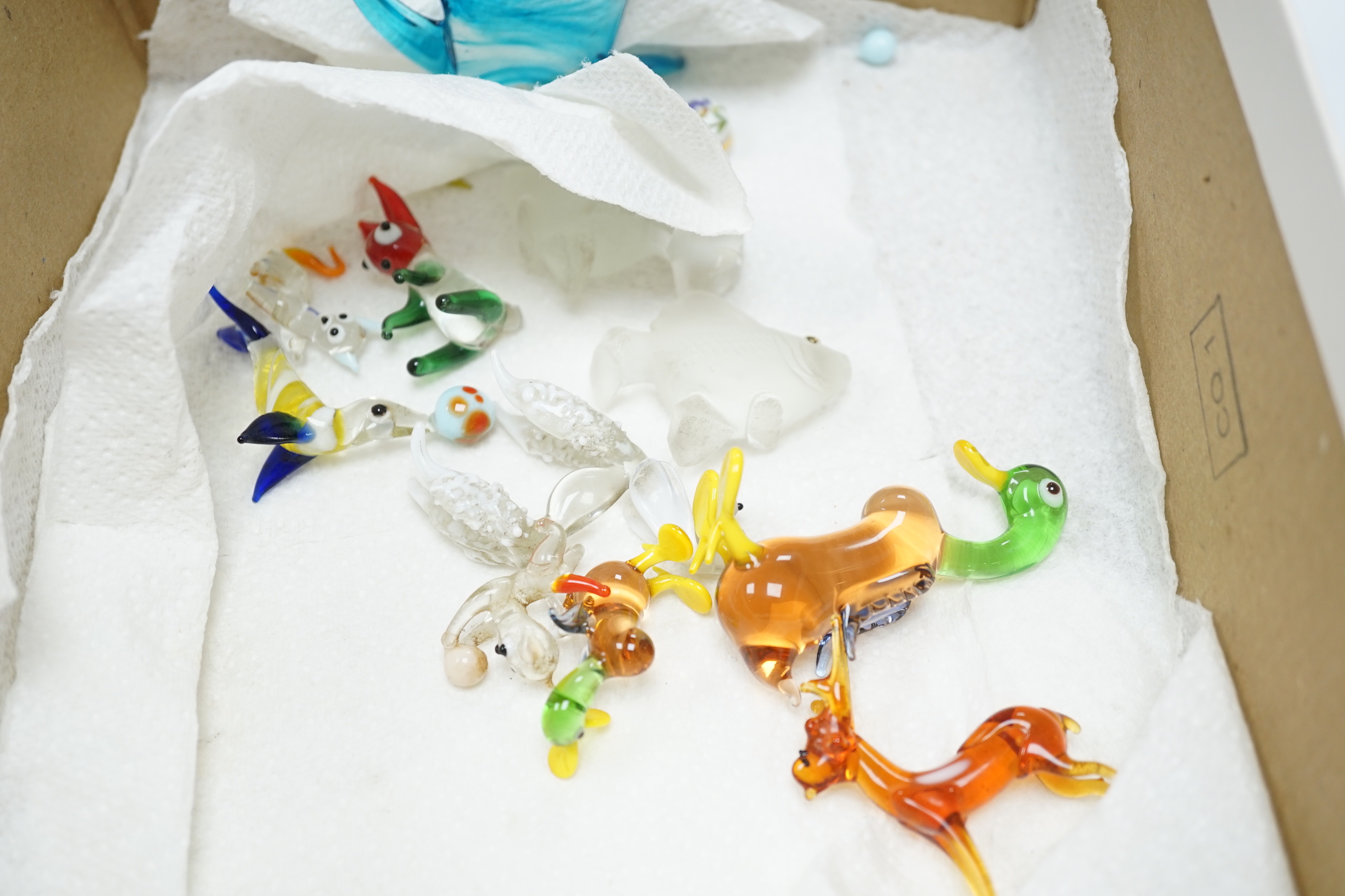 A collection of Murano glass animals including dogs and fish